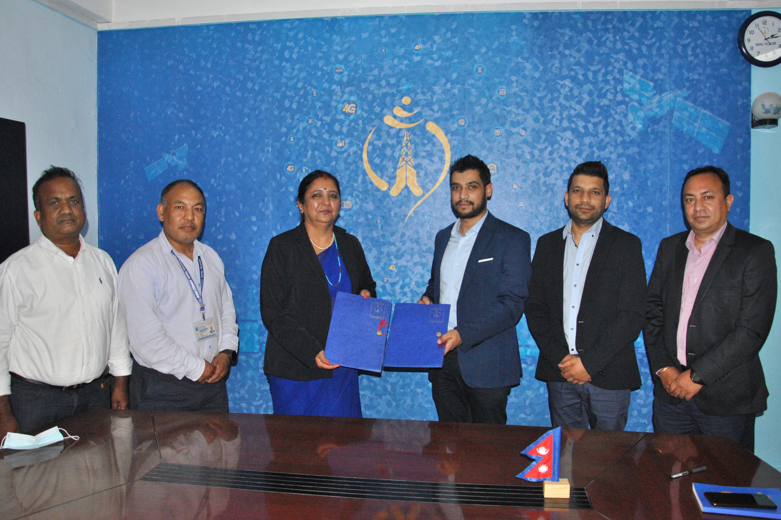Agreement sign between Sangeeta Pahadi, chief business officer of Nepal Telecom and Aditya Anand, Chief Executive Officer of Ultimate Horizon Technologies Pvt. Limited.